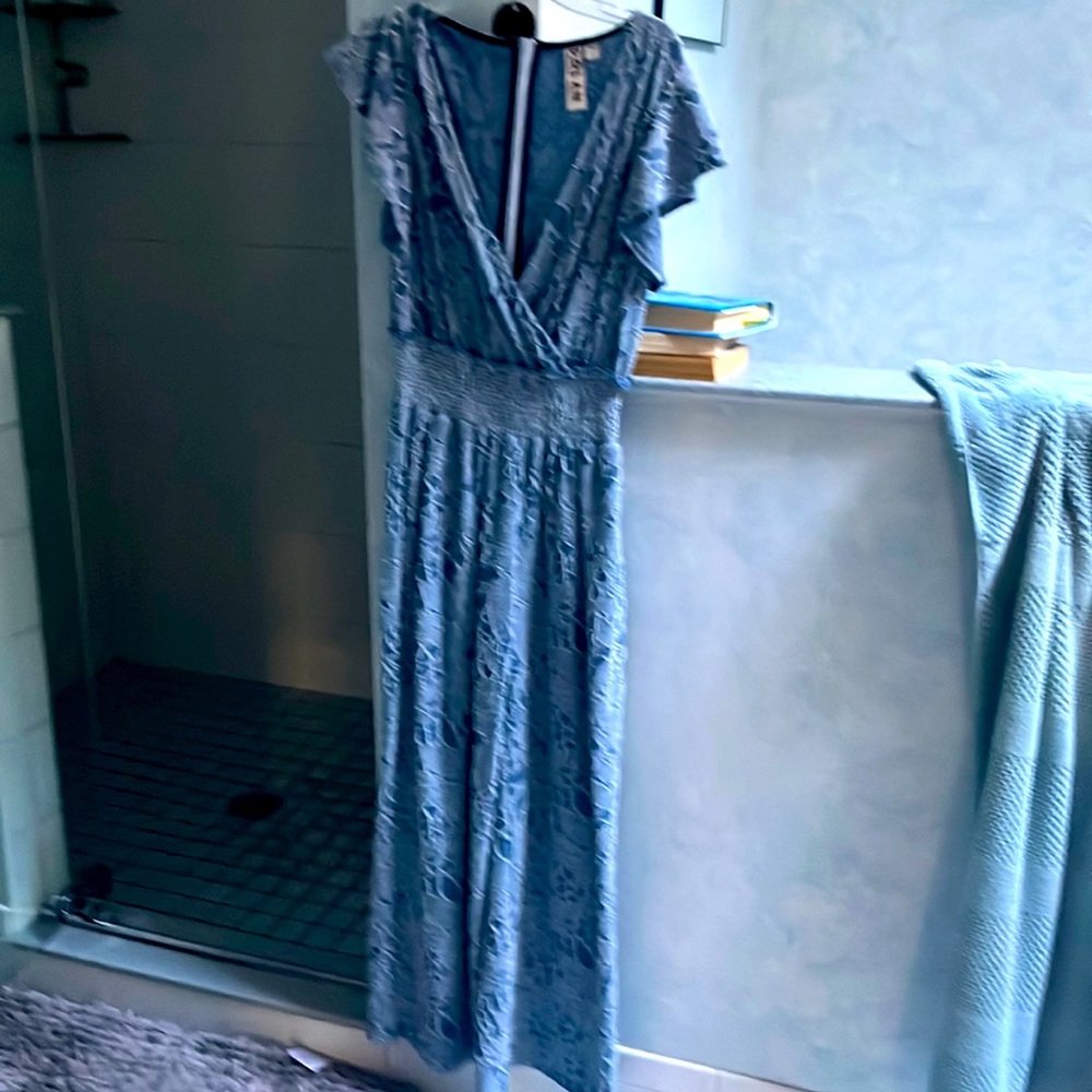Xs light blue pattern jumpsuit from Anthropologie never worn no tags
